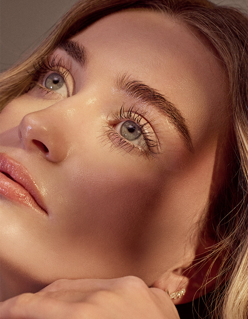 Close-up of a woman's face with a soft focus on her eyes.